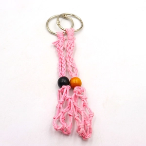 Detail of two handmade pink woven net keychains with adjustable wood bead accents