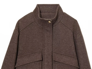 Detailed view of dark brown wool jacket featuring stand collar and gold metal buttons