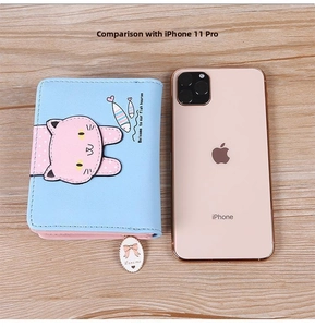 Short cartoon cat print wallet shown next to an iPhone for size comparison