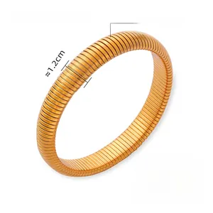 Close-up of flexible golden titanium steel bracelet showing ribbed texture and dimensions