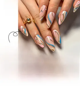 Detail of almond-shaped press-on nails with pink base, blue waves, and rhinestone accents