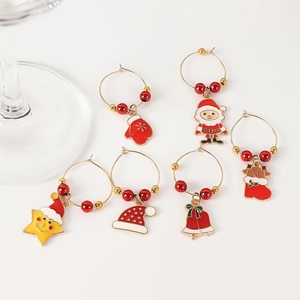 Detailed close-up of 6 alloy Christmas wine glass charms with festive enamel patterns