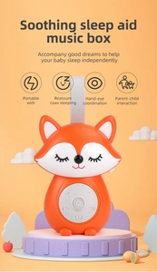 Close-up of portable fox baby sleep aid music box with playback control buttons