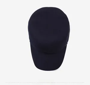 Top view of a dark blue flat top military cap showing the round crown and twill cotton texture