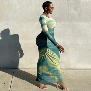 Detail of green gradient tie-dye long sleeve dress showcasing slim fit side profile