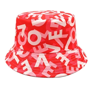 Reversible red bucket hat with pink love heart print and letters for sun protection