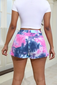 Back view of high-waisted tie-dye denim shorts featuring frayed hems and pink purple hues