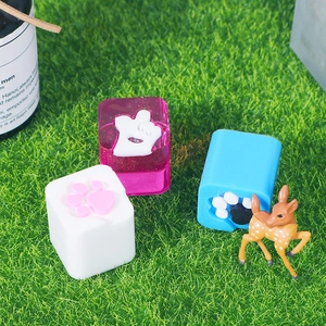 DIY silicone resin cat claw paw molds shown on synthetic grass for custom keycaps