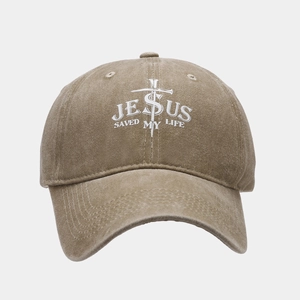 Close-up of Jesus Saved My Life embroidery and washed fabric on the brown cotton cap