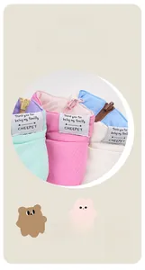 Detail of the reversible pet vest zipper and branded fabric label on warm quilted fabric