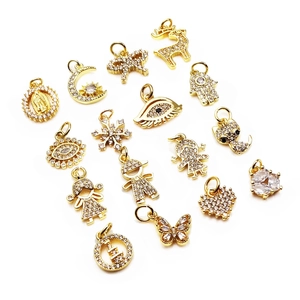 Golden micro-p镶 inlaid charms featuring moon, heart, butterfly, and evil eye designs