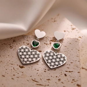 Hollow out 18K gold plated heart earrings with green gems on a textured stone base