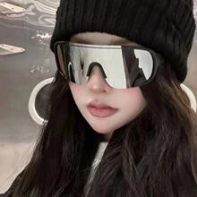 Detail of silver mirrored sports sunglasses with wide black frame and futuristic style