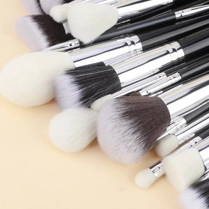 Detail showing dense fibers and silver metal ferrules of professional makeup brushes