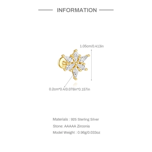 Macro detail of gold S925 sterling silver snowflake stud earrings with AAAAA zircon stones