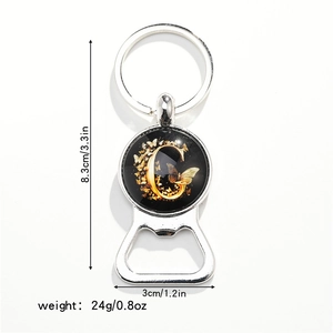Silver metal keychain bottle opener with golden letter G and butterfly dimensions