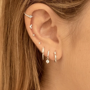 Elegant S925 silver water drop earrings set with sparkling zircon crystals on ear model