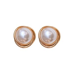 Elegant gold spiral wire wrapped round white pearl stud earrings on a clean white background