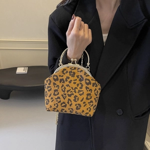 Vintage leopard print shell handbag with metal clasp frame and chain shoulder strap
