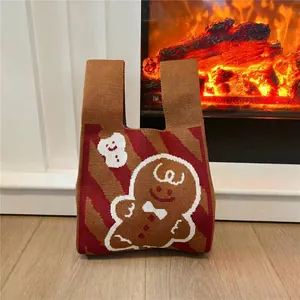 Detail of gingerbread man pattern on thick knit tote bag for Christmas holiday season