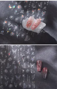 Detail of TL-194 nail stickers featuring 3D pearls, laser butterflies, and calligraphy