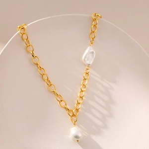 French irregular baroque pearl necklace in 18k gold plated brass with an elegant O-chain