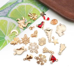 Flat lay of Christmas alloy enamel charms for DIY jewelry making in festive colors