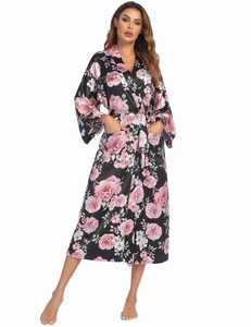 Detail of floral satin bathrobe with pink peonies and functional side pocket