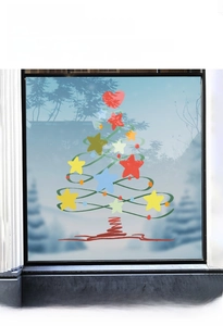 Close-up of Christmas tree window decals with stars and Merry Christmas lettering