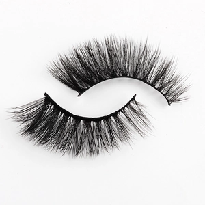 Macro shot of high-quality 3D faux mink eyelashes with dense volume and natural curl