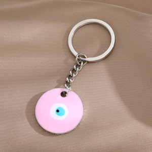 Detail of pink evil eye keychain with enamel drop oil pendant and silver alloy chain
