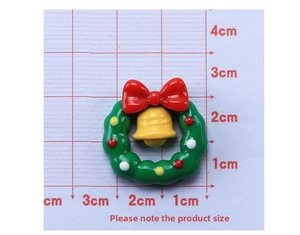 Macro view of Christmas wreath resin accessory with red bow and bell, 2.5cm size