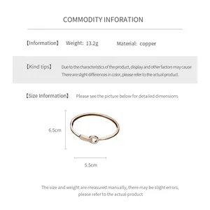 Detail view of gold plated cubic zirconia bangle showing size 6.5cm by 5.5cm measurements