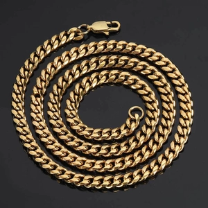 Detail of 18k gold plated Cuban link chain necklace with secure lobster clasp