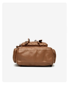 Detail view of large brown washed leather backpack base with studs and stitching