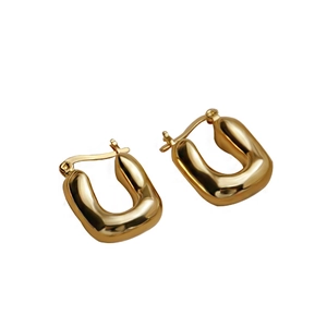 Polished chunky gold U-shaped hoop earrings with minimalist geometric design on white background