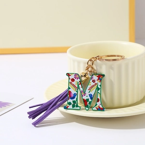 Colorful floral letter M keychain with purple tassel and metal ring for bags