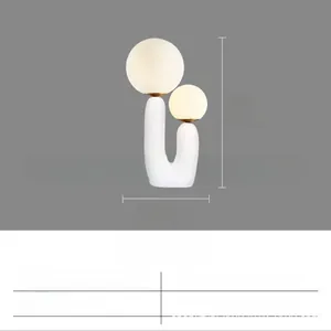 Detailed size specifications of white resin table lamp with dual frosted glass spheres