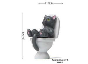 Miniature black cat figurine on white toilet detail with 3.5cm height dimension