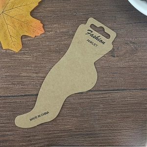 Kraft paper anklet display card with foot-shaped design and Fashion Anklet text