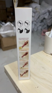 Detail of red anti-scald kitchen gripper packaging showing usage on various materials