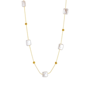 Detail of gold titanium steel necklace with square pearls and golden beads on white background