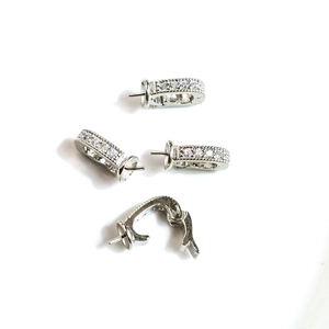 Universal 14k gold-filled clasp with micro-set zircon stones on white background