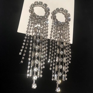 Silver geometric tassel drop earrings with sparkling rhinestones and long fringe design
