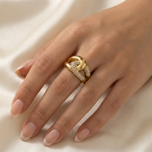 Detailed view of wide gold titanium ring featuring double row diamonds and twisted design