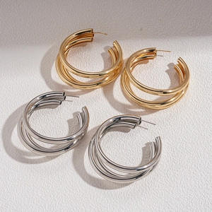 Minimalist geometric multi-layer C-shaped hoop earrings in gold and silver metal finishes