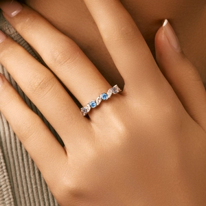 Elegant s925 silver ring featuring round aquamarine and marquise white diamonds