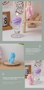 Detailed view of geometric scented candles in pink, purple, and blue for home decor