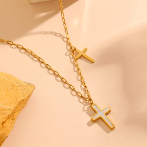 Gold double-layered stainless steel necklace featuring shell-inlaid cross pendants