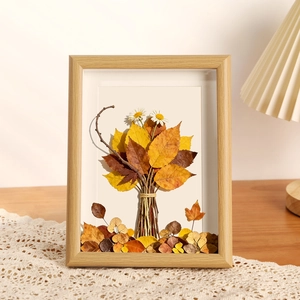 Deep autumn leaf bouquet in a 5x7 natural wood frame with vintage floral art style
